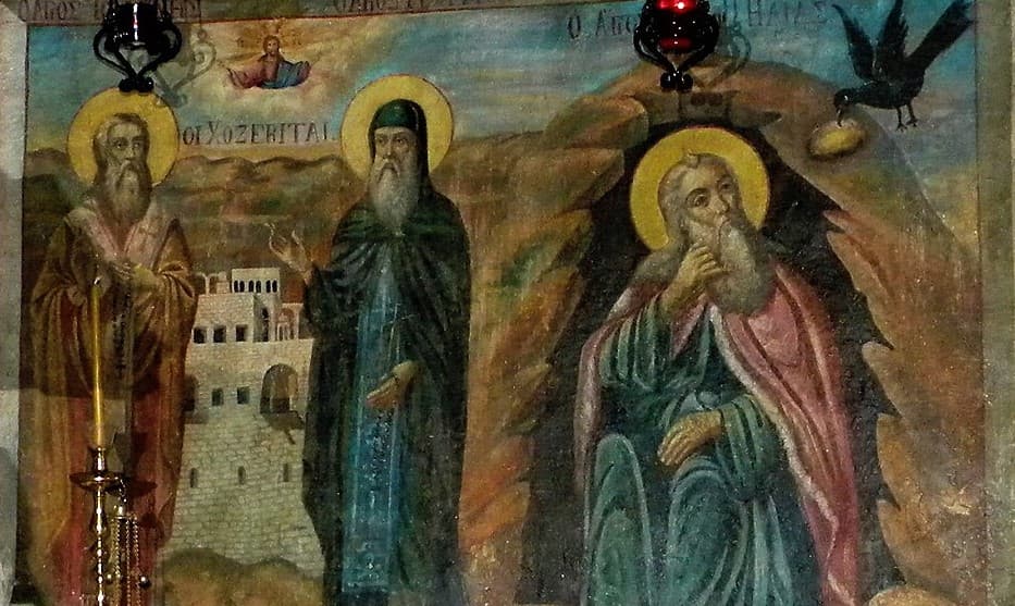 Prepodobný Juraj Chozebita (v strede) spolu so svätým Jánom Chozebitom (vľavo) a prorokom Eliášom v Jaskyni svätého Eliáša v monastieri Chozeba. Zdroj: wikimedia commons
